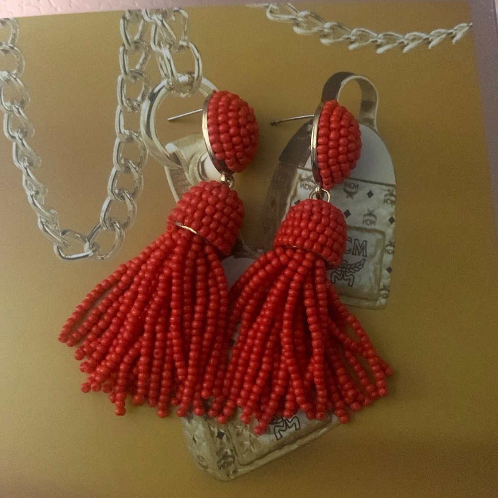 Red tassel earrings, no flaws.
